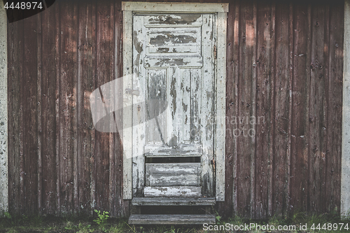 Image of Old wooden door with weathered paint