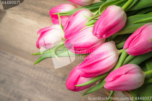 Image of Beautiful bouquet from pink tulips  on a table