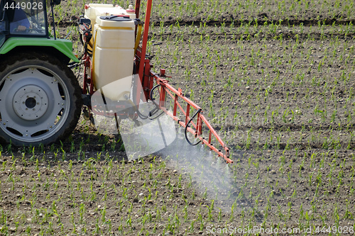 Image of Tractor spraying pesticide