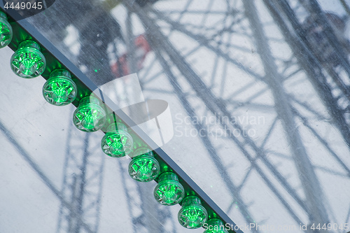 Image of Green lights of a big wheel