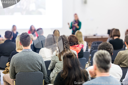 Image of Woman giving presentation on business conference workshop.