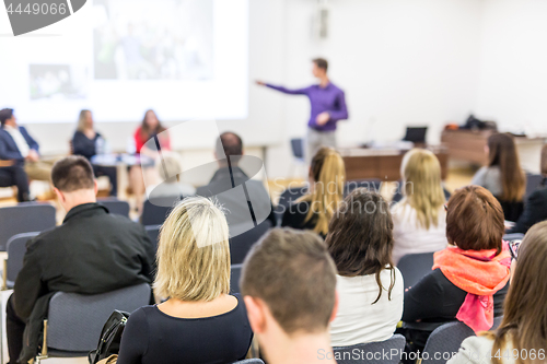 Image of Business speaker giving a talk at business conference event.