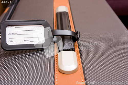 Image of Black Luggage Tag On Baggage