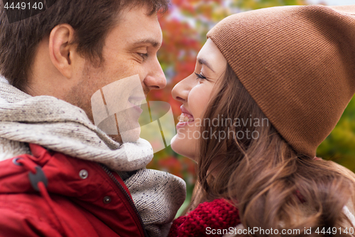 Image of close up of happy teenage couple in autumn