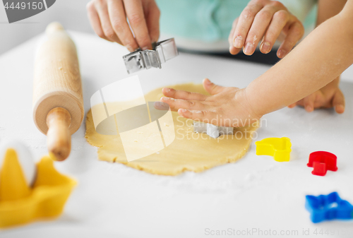 Image of mother and daughter making cookies at home