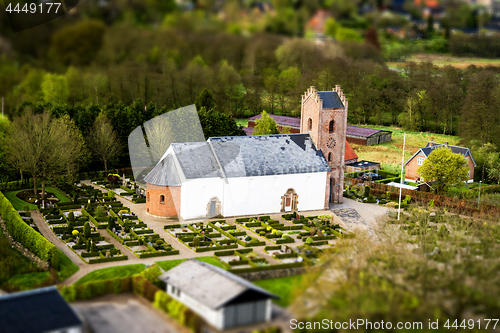 Image of Danish church with a cemetary