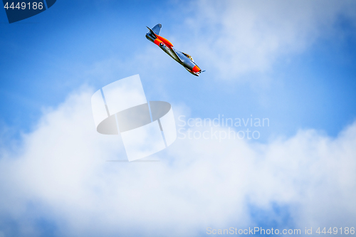 Image of Plane diving on a blue sky