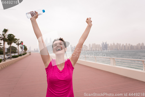 Image of young woman celebrating a successful training run