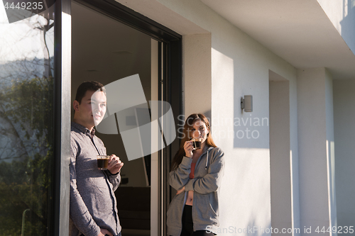 Image of couple enjoying on the door of their luxury home villa