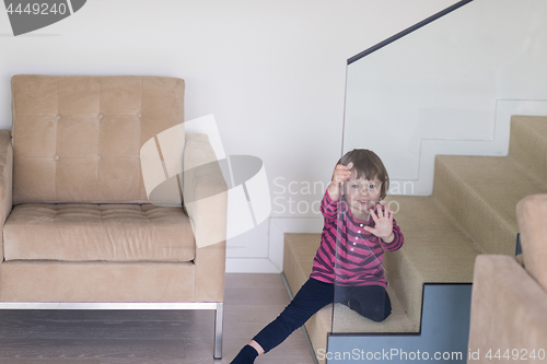 Image of little cute girl enjoying on the stairs