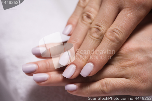 Image of woman fingers with french manicure