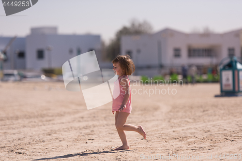 Image of little cute girl at beach