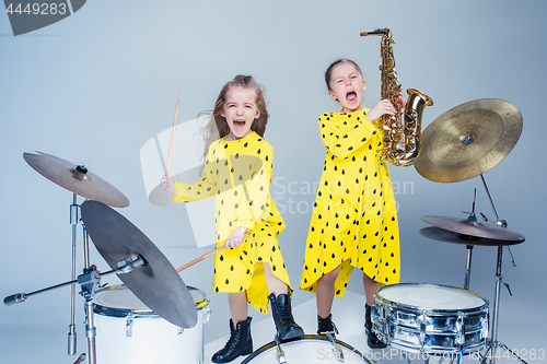 Image of The teen music band performing in a recording studio