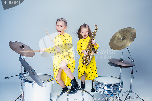 Image of The teen music band performing in a recording studio