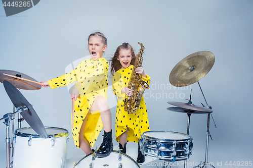 Image of The teen music band performing in a recording studio