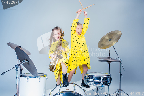 Image of The teen music band performing in a recording studio