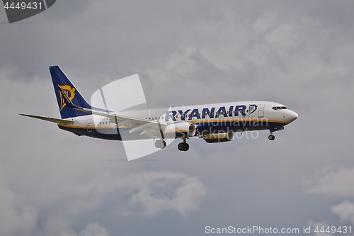 Image of Plane landing in cloudy weather