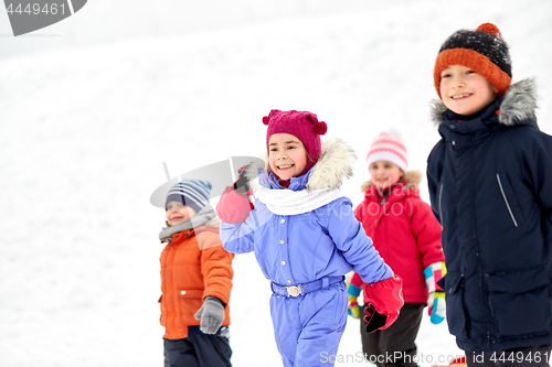 Image of happy little kids outdoors in winter