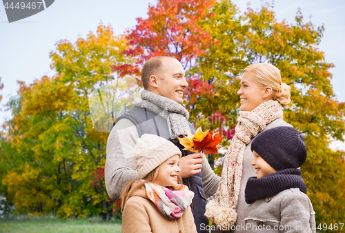 Image of happy family over autumn park background