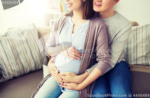 Image of close up of man and pregnant woman