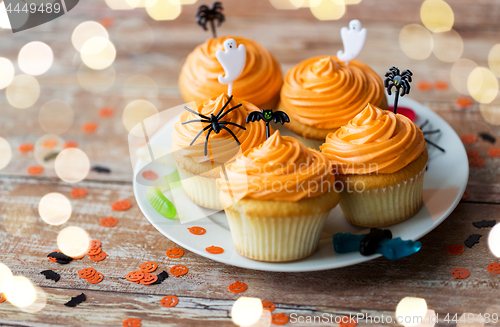 Image of halloween party decorated cupcakes on plate