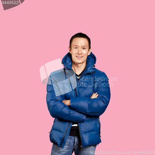 Image of Asian man in blue down-padded coat