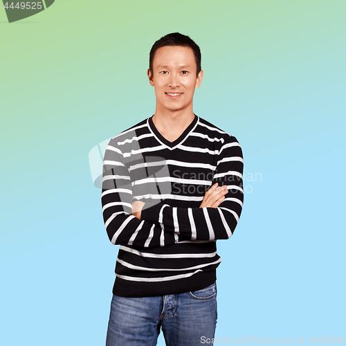 Image of Asian man in striped pullovert