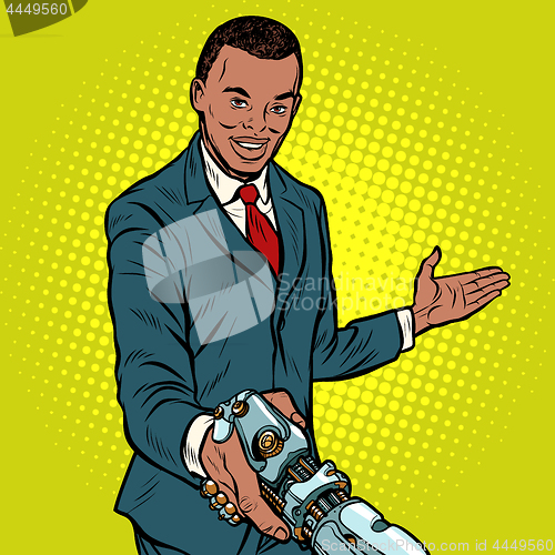 Image of African businessman handshake to robot