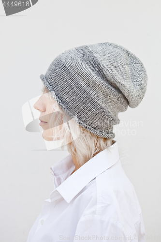 Image of Wwoman in warm grey beanie wool knitted hat.