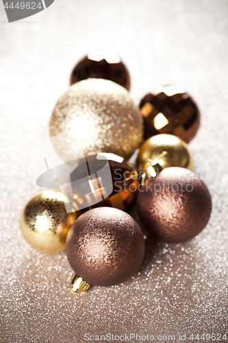 Image of Christmas golden and brown decorations.