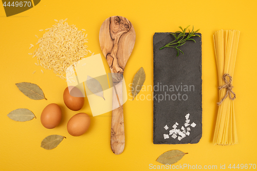 Image of Cooking ingredients on bright yellow background