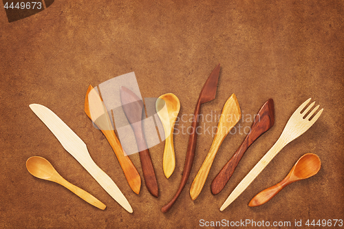 Image of Handcrafted wooden utensils on leather background