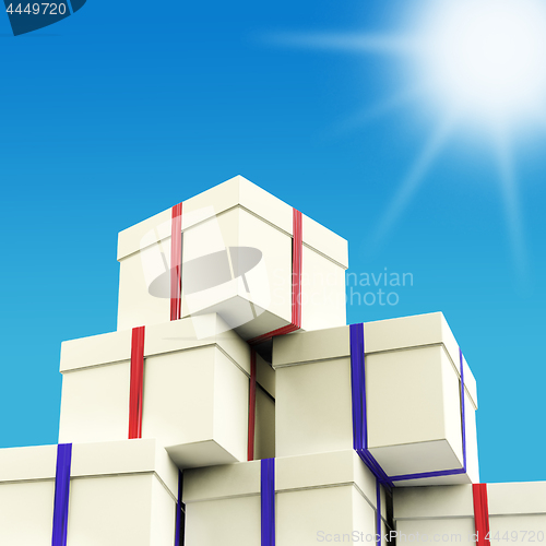 Image of Stack Of Giftboxes With Sun And Sky Background As Presents For T