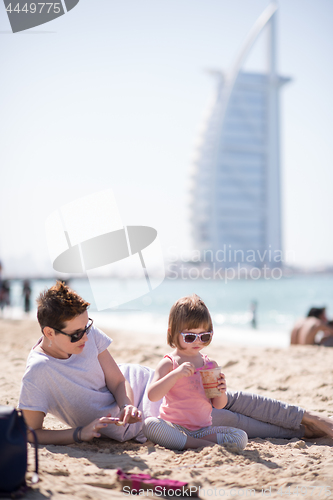 Image of Mom and daughter on the beach