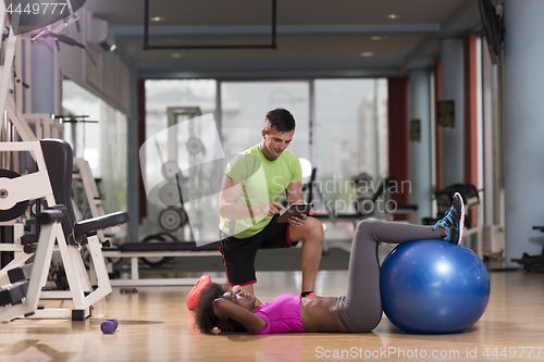 Image of pilates  workout with personal trainer at gym