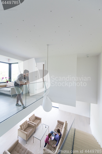 Image of family with little girl enjoys in the modern living room