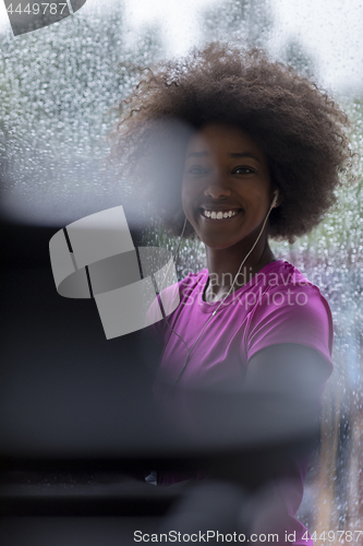 Image of portrait of young afro american woman in gym