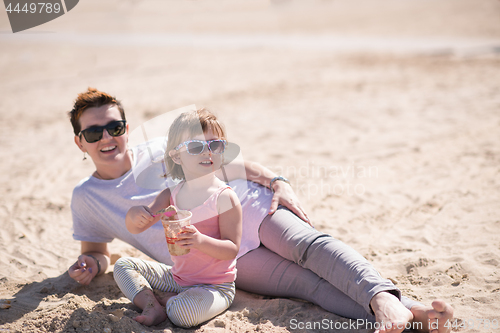 Image of Mom and daughter on the beach