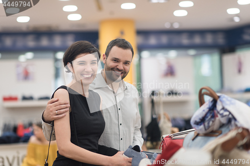 Image of couple chooses shoes At Shoe Store