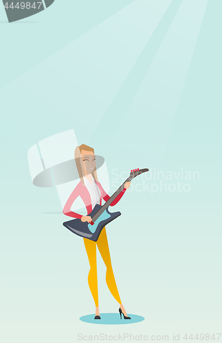 Image of Woman playing the electric guitar.