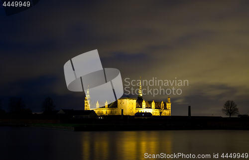 Image of Kronborg Castle at night seen from Elsinore harbour