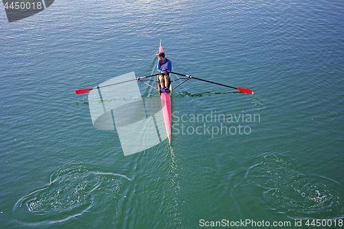 Image of Single scull rowing competitor, rowing race one rower