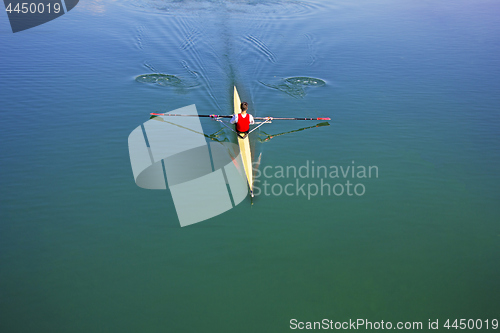 Image of Single scull rowing competitor, rowing race one rower