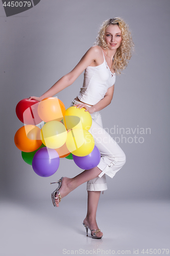 Image of Young Woman With Balloons