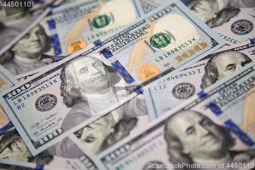 Image of Close up of new hundred dollar bill with portrait of Franklin