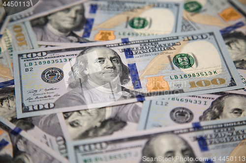 Image of Close up of new hundred dollar bill with portrait of Franklin