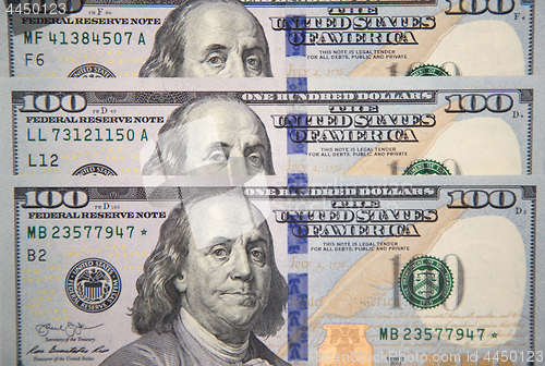 Image of Close up of new hundred dollar bill with portrait of Franklin