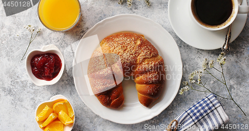 Image of Baked croissant with drinks on table