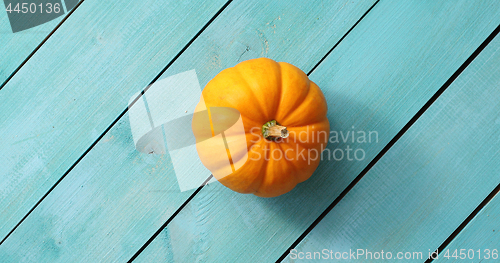 Image of Yellow pumpkin lain in middle