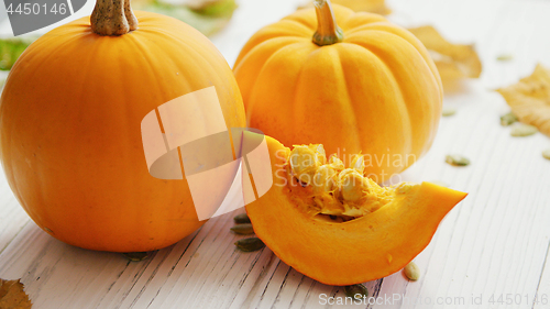 Image of Yellow pumpkins laid on table